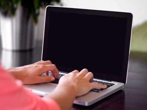 laptop on hands